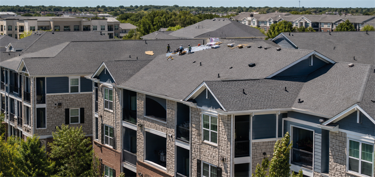 Roofing work on an apartment complex